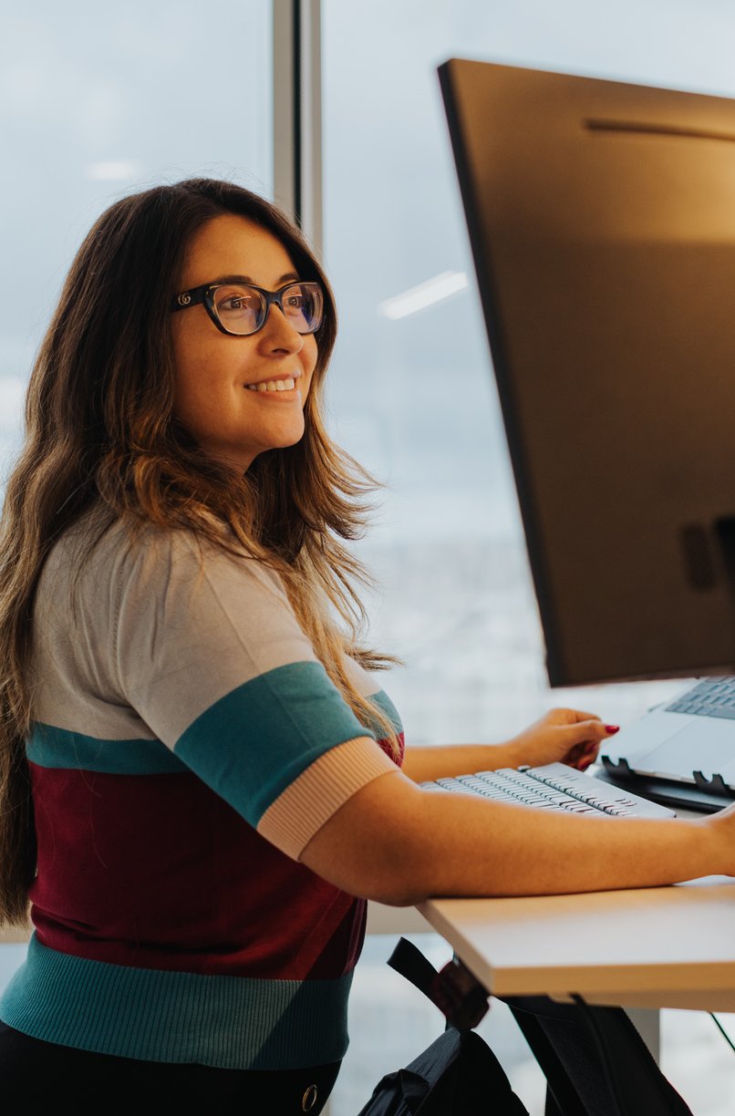 Team member focused at a standing desk